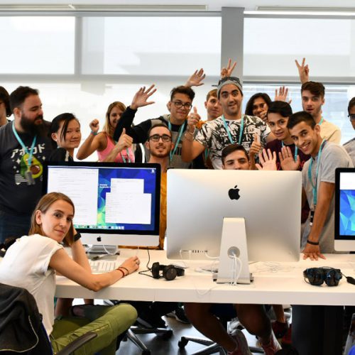 Group of happy students raising their arms or thumbs - 42 Madrid (Spain)