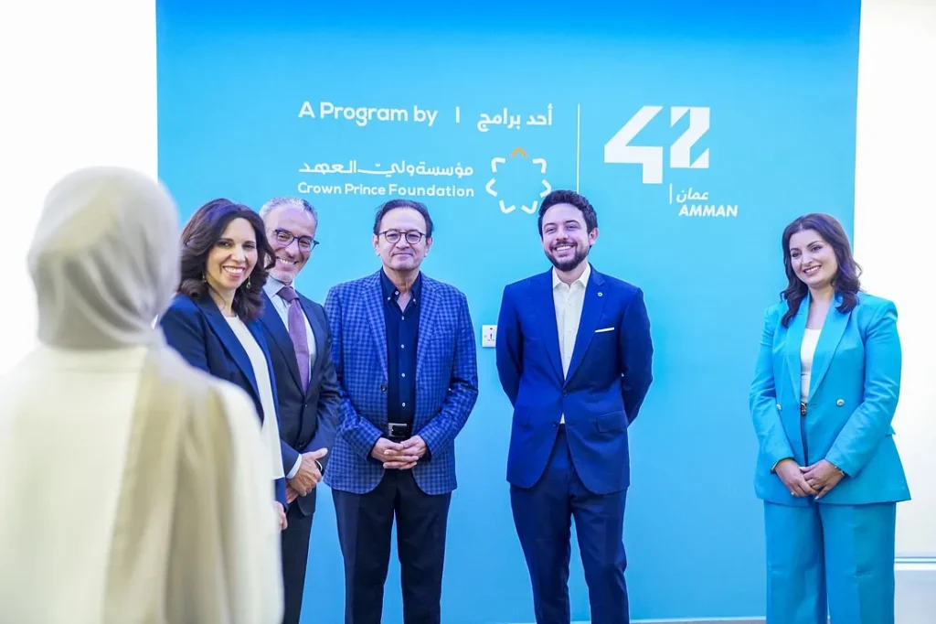 Tina Sweiss (right) and His Majesty the Crown Prince Hussein Bin Abdallah (centre-right).