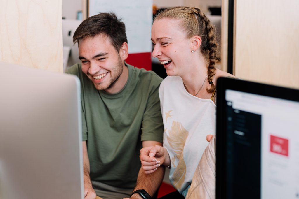 Students working and laughing